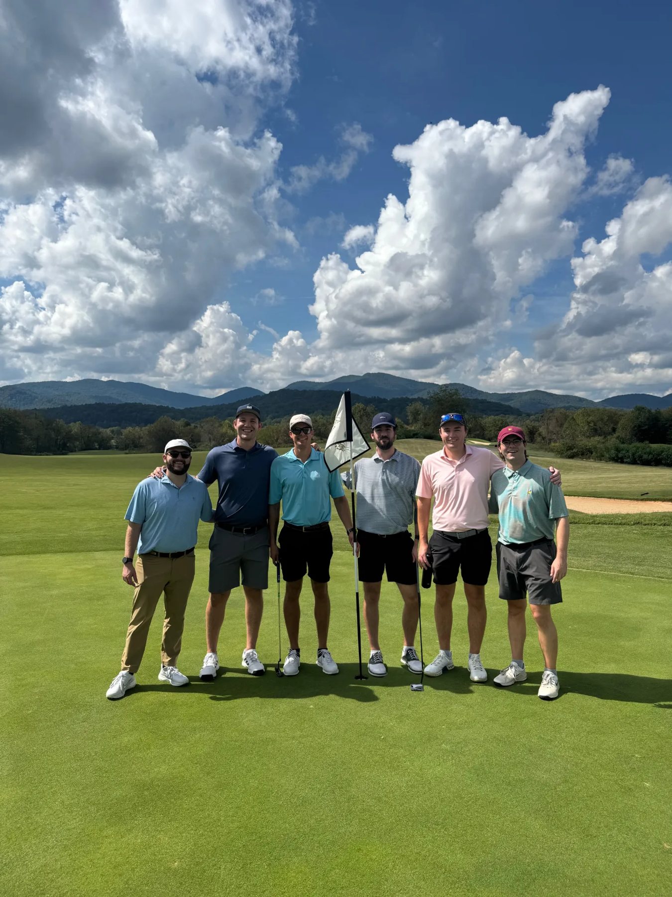 Caleb golfing with friends in the mountains